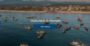 A scenic view of the coastline with fishing boats in Vietnam, perfect for a beach holiday at ROBINSON Clubs.