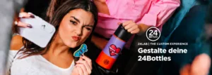 Young woman taking a playful selfie with a customized 24Bottles water bottle featuring a colorful design.